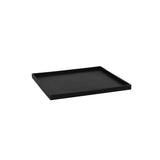 Black Pottery Pots coaster block on a wooden surface, showcasing its sleek design and smooth finish.